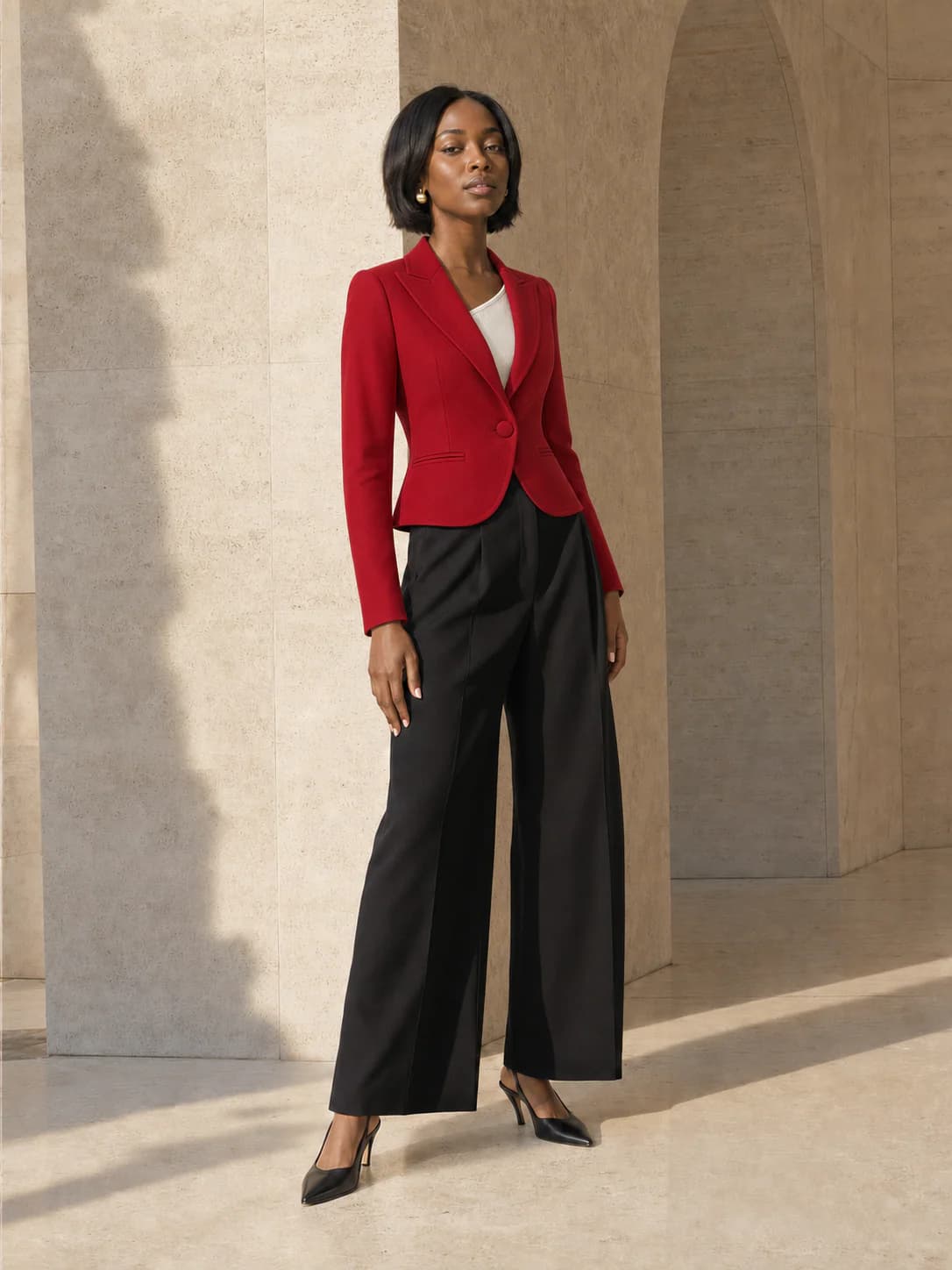 AI try-on result of the same person wearing the cherry-red blazer